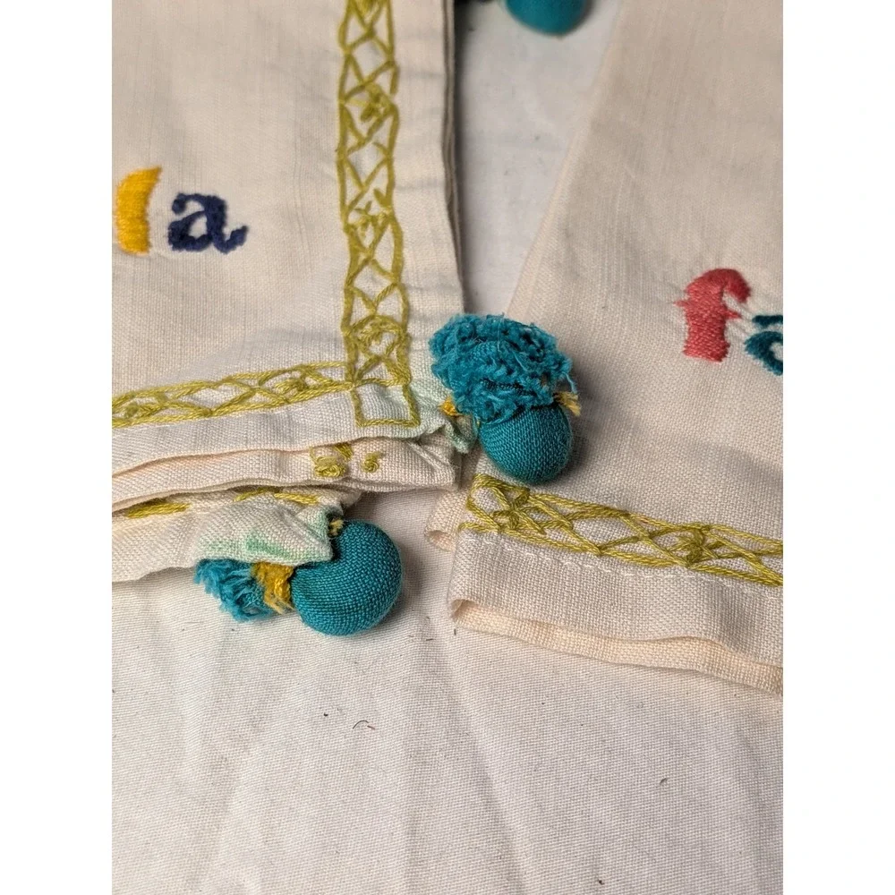 Set of 4 Fa La La Embroidered Christmas Napkins Cream with Teal Pom Tassels